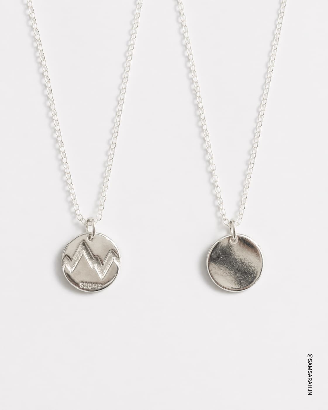 Round Silver Crest Pendant 520 Frequency Necklace — close up